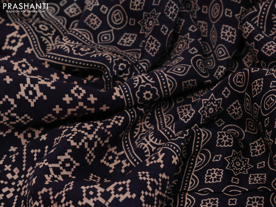 Modal silk saree black with allover ikat prints and ajrakh printed pallu