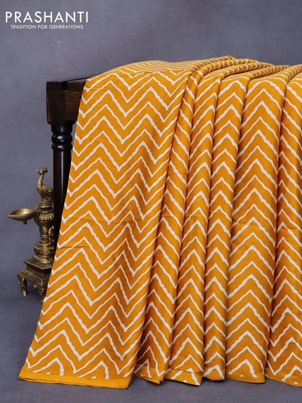 Modal silk saree mustard yellow with allover zig zag prints and ajrakh printed pallu
