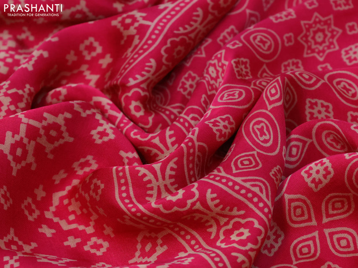 Modal silk saree pink with allover ikat prints and ajrakh printed pallu