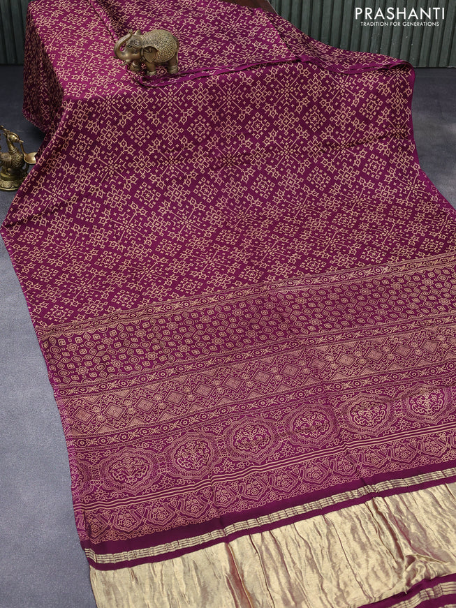 Modal silk saree dark magenta pink with allover ikat prints and ajrakh printed pallu