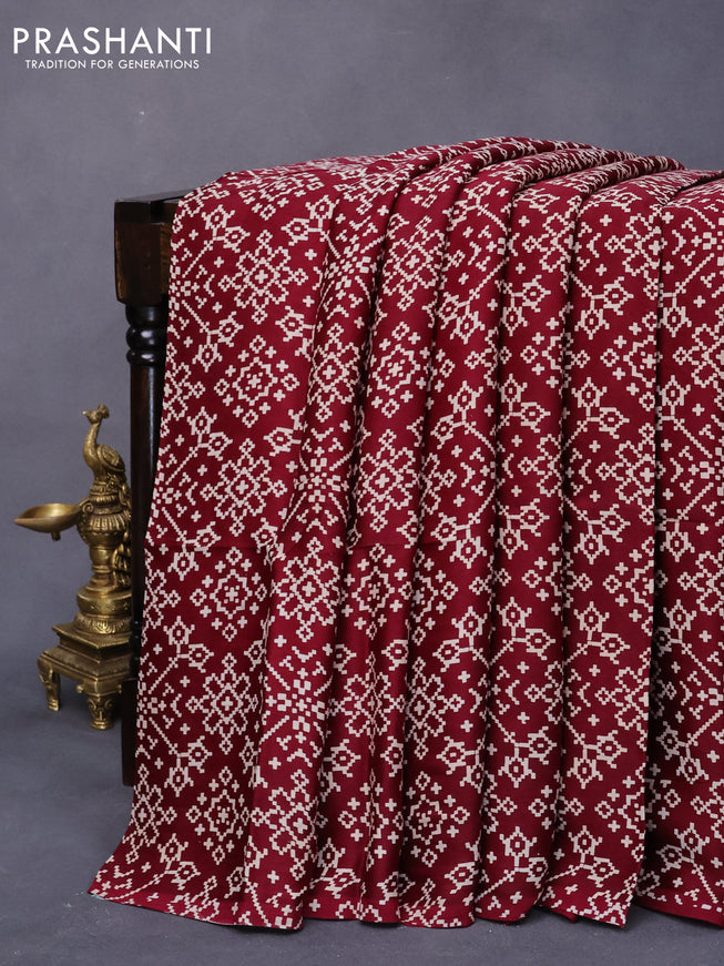 Modal silk saree deep maroon with allover ikat prints and ajrakh printed pallu