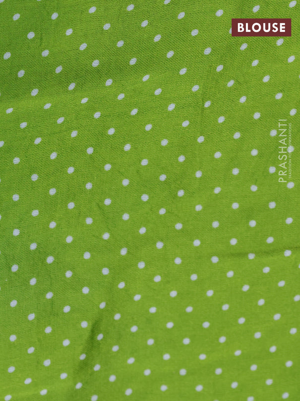 Modal silk saree fluorescent green with allover zig zag prints and ajrakh printed pallu