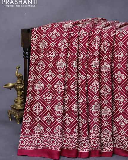 Modal silk saree maroon with allover patola prints and zari woven pallu