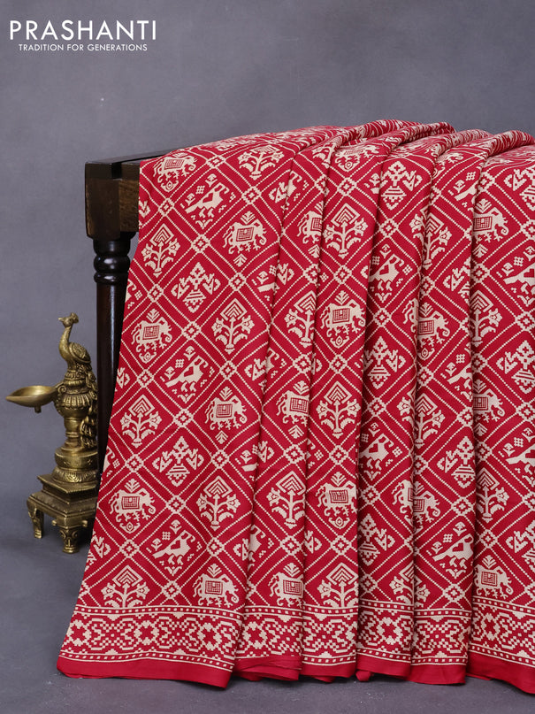 Modal silk saree red with allover patola prints and zari woven pallu