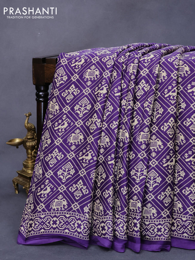 Modal silk saree violet with allover patola prints and zari woven pallu