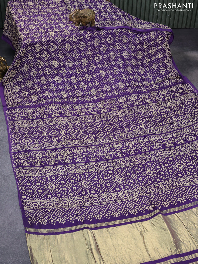 Modal silk saree violet with allover patola prints and zari woven pallu