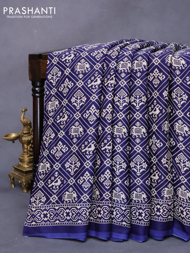 Modal silk saree blue with allover patola prints and zari woven pallu