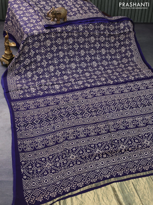 Modal silk saree blue with allover patola prints and zari woven pallu