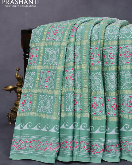 Modal silk saree pastel green with allover zari checks & ajrakh butta prints and zari woven pallu