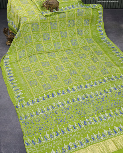Modal silk saree fluorescent green with allover zari checks & ajrakh butta prints and zari woven pallu