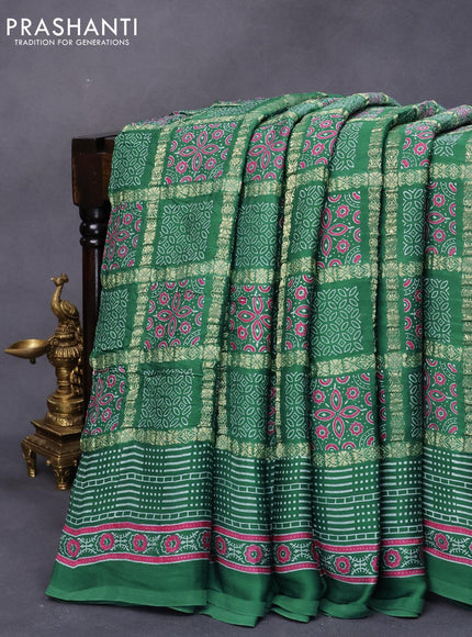 Modal silk saree green shade with allover zari checks & ajrakh butta prints and zari woven pallu