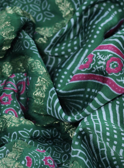 Modal silk saree green shade with allover zari checks & ajrakh butta prints and zari woven pallu