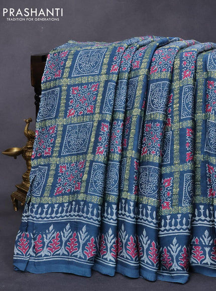 Modal silk saree blue shade with allover zari checks & ajrakh butta prints and zari woven pallu