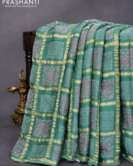 Modal silk saree green shade with allover zari checks & ajrakh butta prints and zari woven pallu