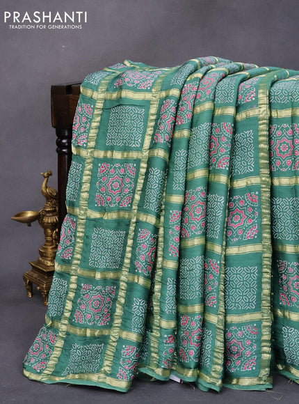 Modal silk saree green shade with allover zari checks & ajrakh butta prints and zari woven pallu