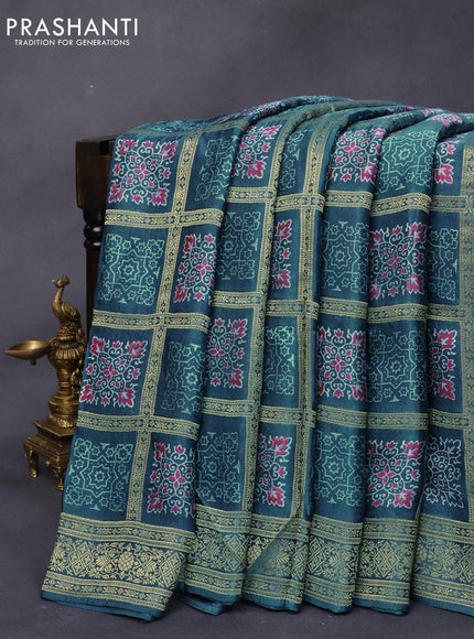 Modal silk saree blue shade with allover zari checks & ajrakh butta prints and zari woven pallu