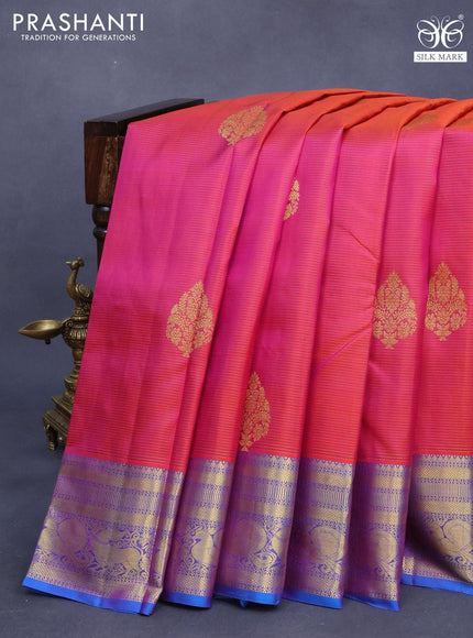 Pure kanjivaram silk saree dual shade of pinkish orange and dual shade of cs blue with allover zari weaves & buttas and zari woven annam border