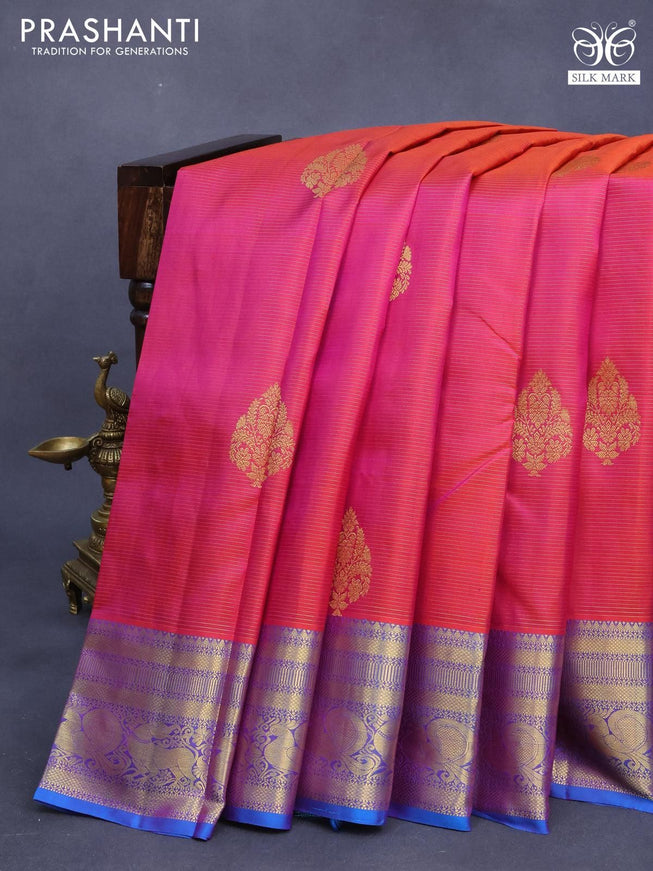 Pure kanjivaram silk saree dual shade of pinkish orange and dual shade of cs blue with allover zari weaves & buttas and zari woven annam border