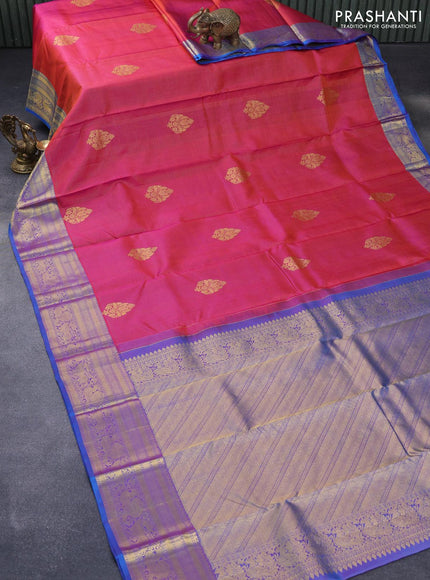 Pure kanjivaram silk saree dual shade of pinkish orange and dual shade of cs blue with allover zari weaves & buttas and zari woven annam border