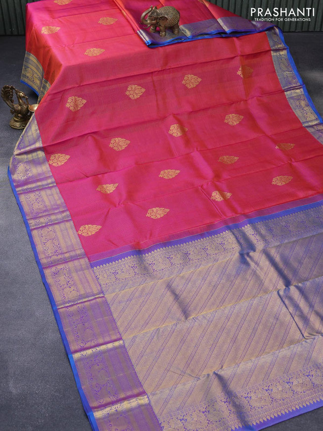 Pure kanjivaram silk saree dual shade of pinkish orange and dual shade of cs blue with allover zari weaves & buttas and zari woven annam border