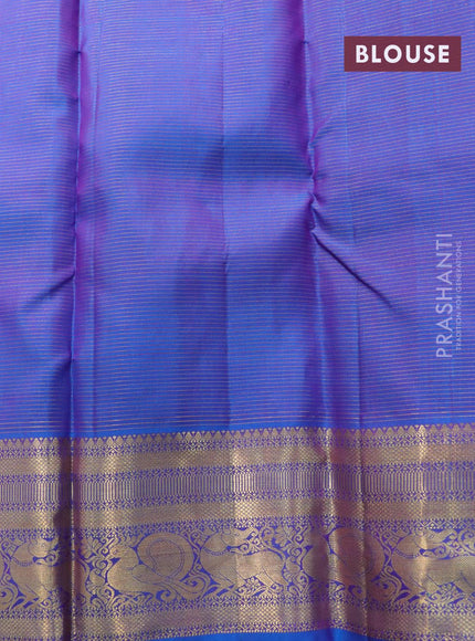 Pure kanjivaram silk saree dual shade of pinkish orange and dual shade of cs blue with allover zari weaves & buttas and zari woven annam border