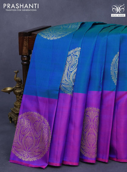 Pure kanjivaram silk saree dual shade of bluish green and purple with zari woven buttas and zari woven butta border