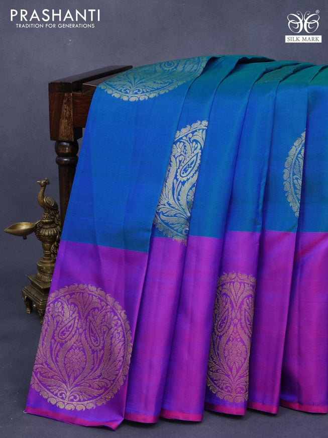 Pure kanjivaram silk saree dual shade of bluish green and purple with zari woven buttas and zari woven butta border