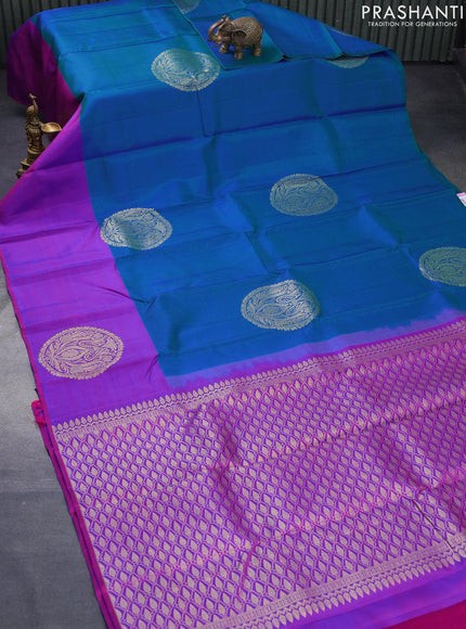 Pure kanjivaram silk saree dual shade of bluish green and purple with zari woven buttas and zari woven butta border