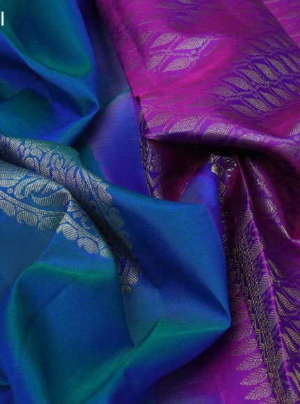 Pure kanjivaram silk saree dual shade of bluish green and purple with zari woven buttas and zari woven butta border