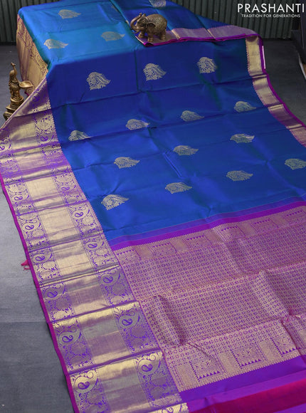 Pure kanjivaram silk saree dual shade of bluish green and dual shade of purple with zari woven buttas and long rich zari woven border