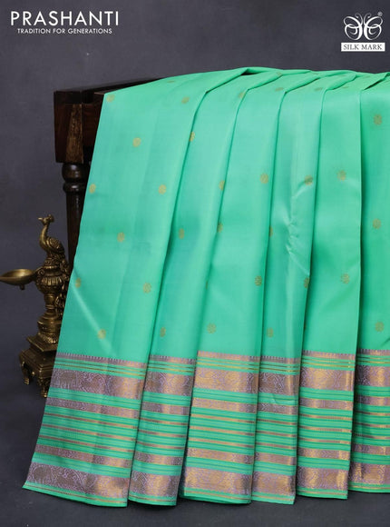 Pure kanjivaram silk saree teal green with allover zari woven buttas and zari woven border