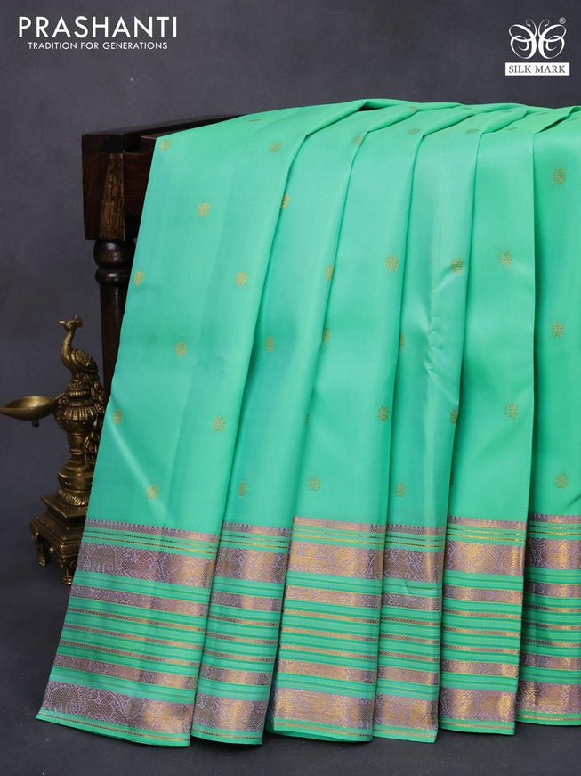 Pure kanjivaram silk saree teal green with allover zari woven buttas and zari woven border