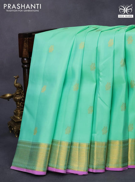 Pure kanjivaram silk saree teal green shade and pink with annam zari woven buttas and zari woven border