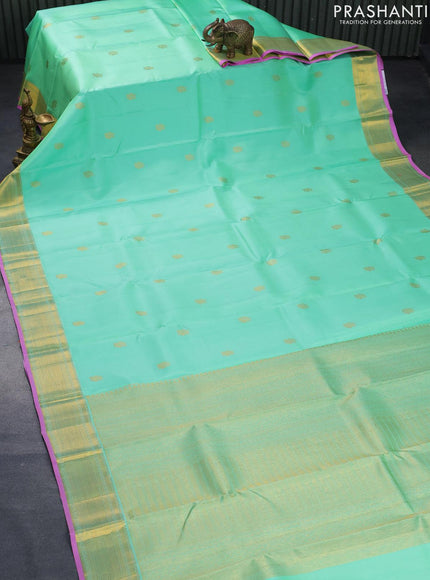 Pure kanjivaram silk saree teal green shade and pink with annam zari woven buttas and zari woven border