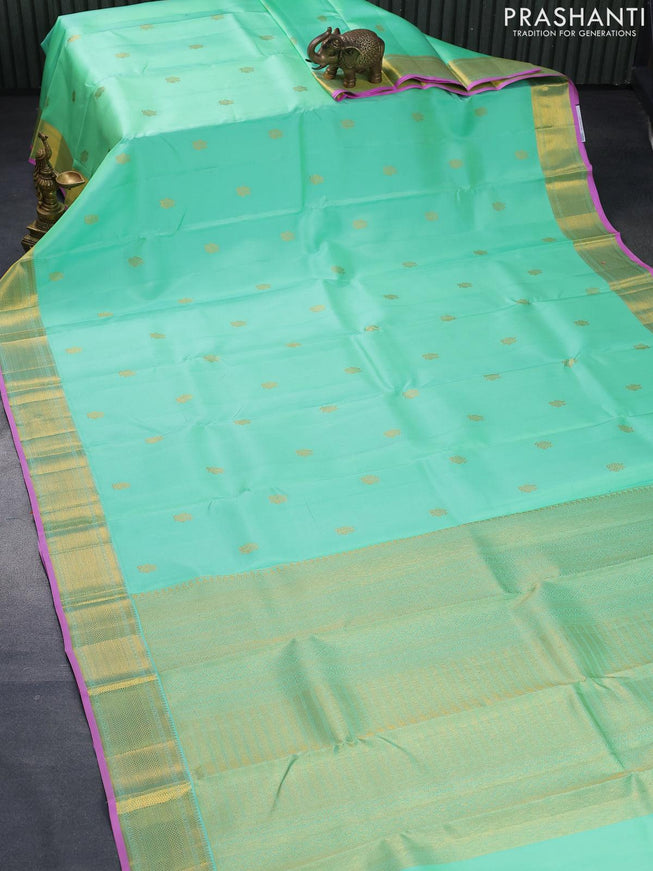 Pure kanjivaram silk saree teal green shade and pink with annam zari woven buttas and zari woven border