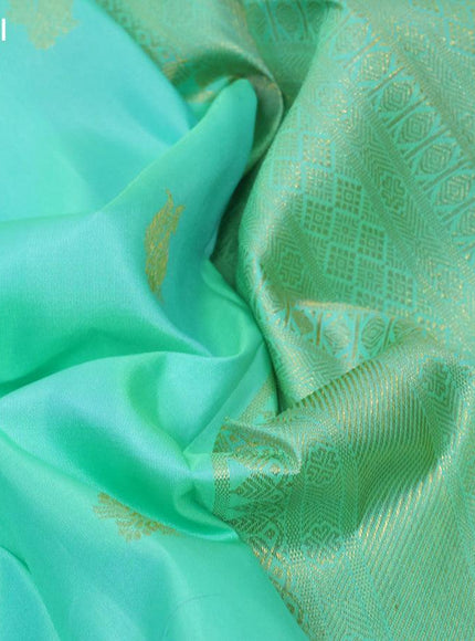 Pure kanjivaram silk saree teal green shade and pink with annam zari woven buttas and zari woven border