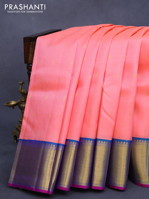 Pure kanjivaram silk saree peach pinkish orange and dual shade bluish green with zari woven buttas and zari woven border