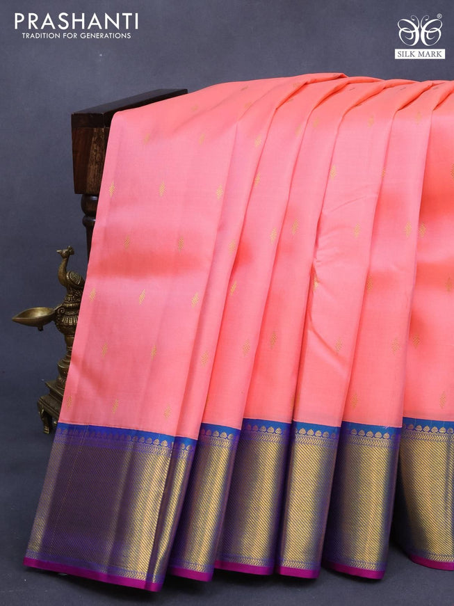 Pure kanjivaram silk saree peach pinkish orange and dual shade bluish green with zari woven buttas and zari woven border