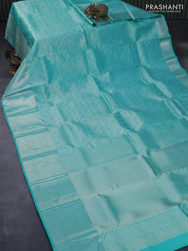 Pure kanjivaram silk saree teal blue with allover silver zari woven brocade weaves and silver zari woven border