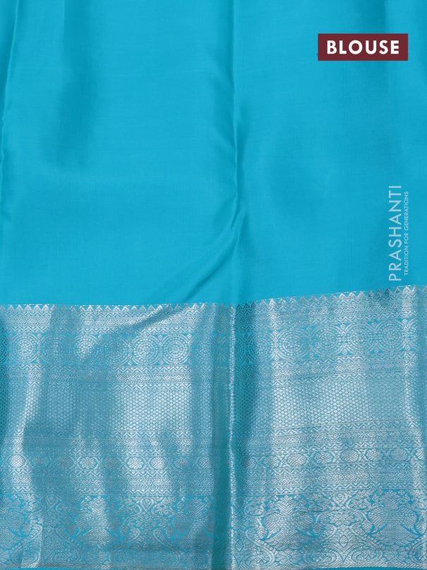 Pure kanjivaram silk saree teal blue with allover silver zari woven brocade weaves and silver zari woven border