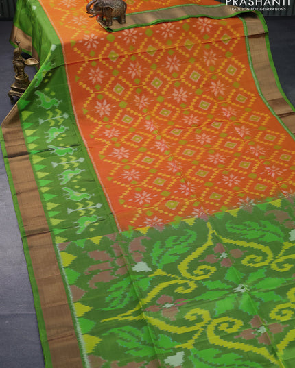 Ikat soft silk saree orange and light green with allover ikat weaves and long ikat woven zari border