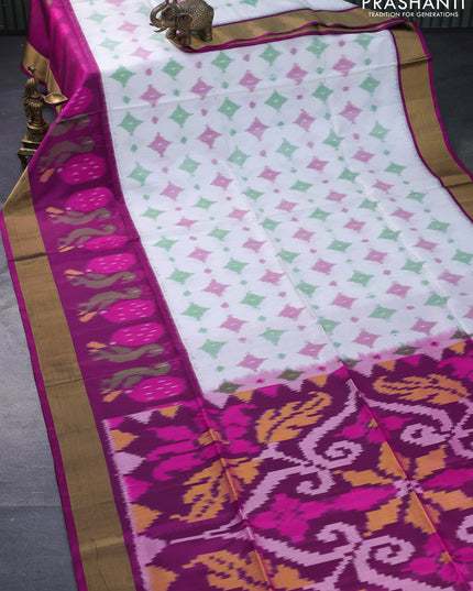 Ikat soft silk saree off white and magenta pink with allover ikat butta weaves and long ikat woven zari border