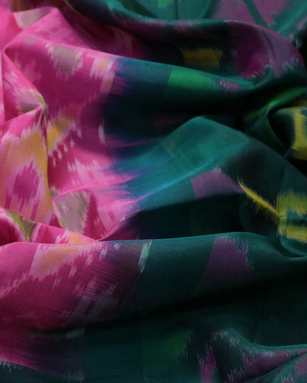 Ikat soft silk saree pink and dark green with allover ikat weaves and long ikat woven zari border