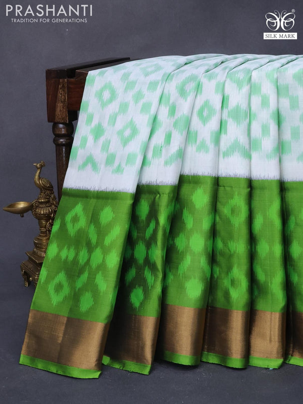 Ikat soft silk saree off white and green with allover ikat weaves and long ikat woven zari border