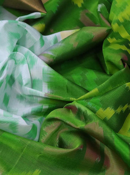 Ikat soft silk saree off white and green with allover ikat weaves and long ikat woven zari border