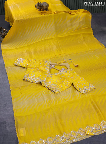 Organza silk saree yellow with allover zari stripes pattern and gottapatti lace work border & embroidered readymade blouse