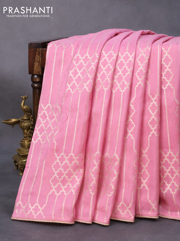 Banarasi munga tussar saree light pink with allover zari woven geometric weaves and lace work border & embroidered readymade blouse