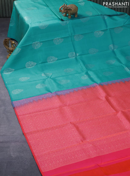 Pure kanjivaram silk saree teal blue and dual shade of pinkish orange with silver zari woven buttas in borderless style