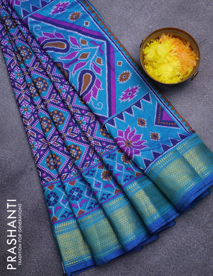 Semi tussar saree dark blue and dual shade of teal green with allover ikat prints and zari woven border