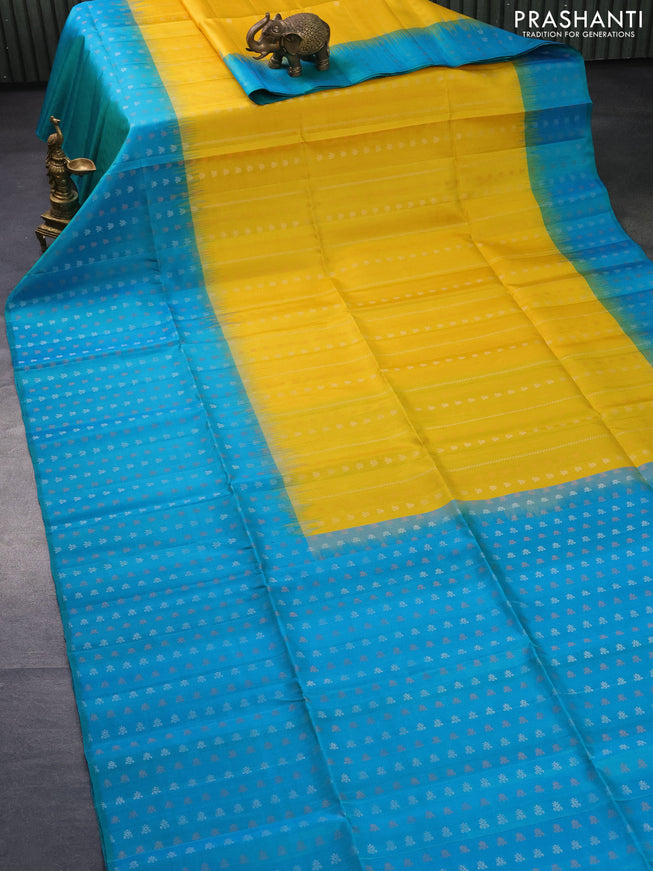 Pure soft silk saree yellow and dual shade of teal blue with silver & copper zari weaves and zari woven butta border